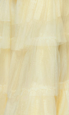 Close-up of sheer yellow fabric with a soft, textured look—ideal for the Long Ruffled Prom Dress: Blondie Nites 4637BN, featuring layered ruffles and a sweetheart bodice in an elegant A-line silhouette.