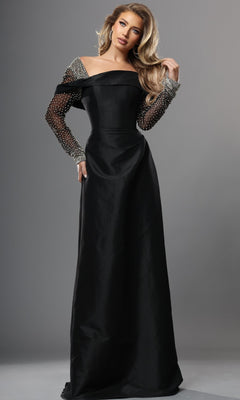 A woman wearing the Jovani 46769 long formal dress in black, featuring an elegant A-line silhouette and sheer, beaded off-the-shoulder sleeves, stands against a plain gray background.