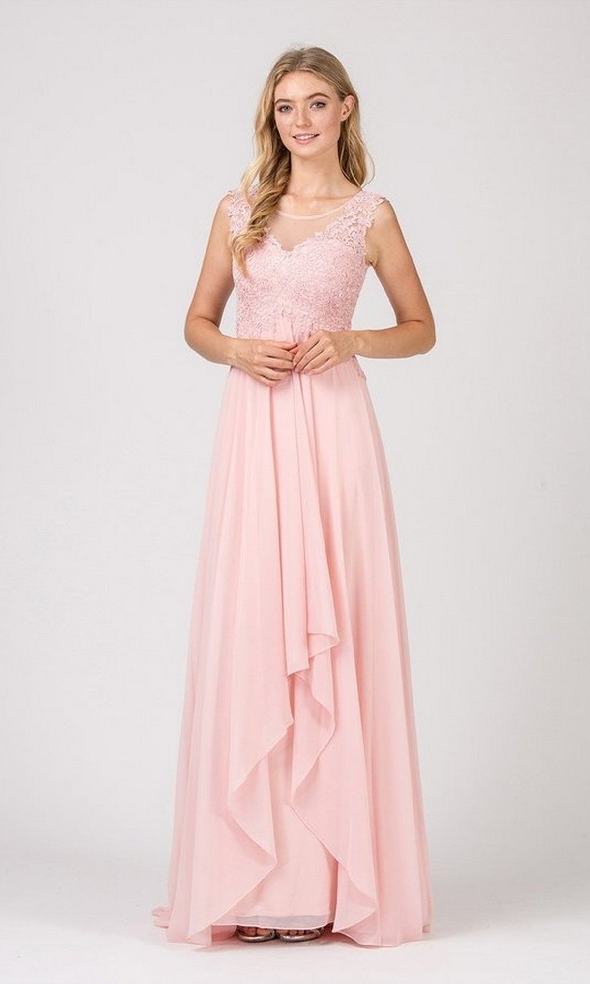 A woman stands in a studio wearing the Eureka 4711 Long Prom Dress: a sleeveless, floor-length gown in dusty pink chiffon with lace bodice detail and a layered, flowing skirt.