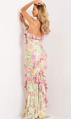 Woman modeling the Jovani 47236 Ruffled Long Floral-Print Prom Gown with spaghetti straps, shown from the back against a plain white background.