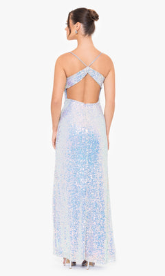 A woman wears the Blondie Nites Long Sequin Prom Dress 4727BN, featuring iridescent sequins, crisscross straps, and an open back, as she stands facing away from the camera.