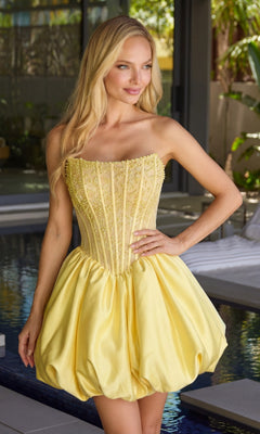 A woman stands by a pool wearing the Ava Presley 47306 short cocktail dress in yellow, which features a strapless, fitted pearl-embellished bodice and a voluminous skirt.