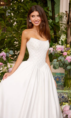 A white strapless Ava Presley 47364 ball gown featuring a beaded bodice and a full floor-length skirt.
