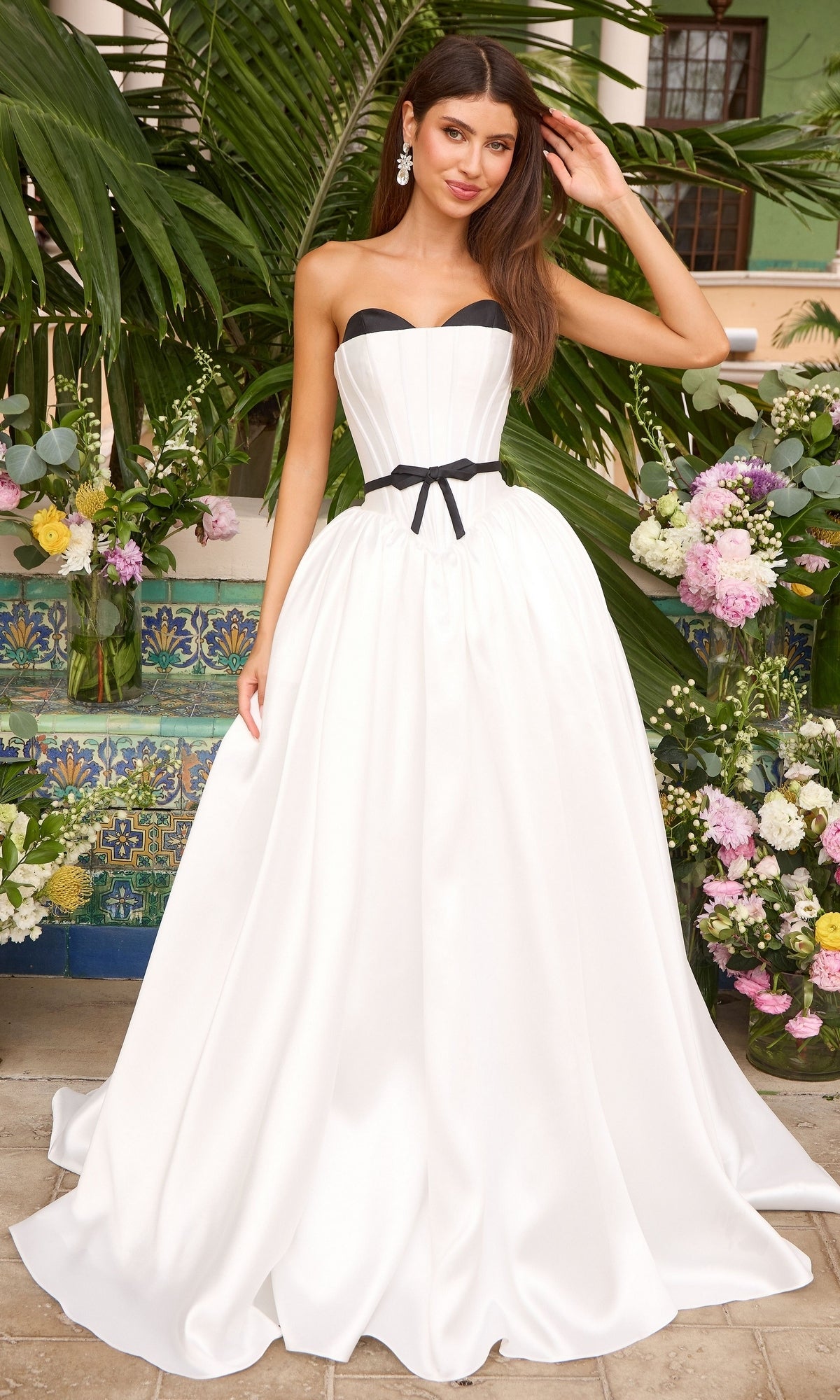Long Prom Dress: Ava Presley 47365, a floor-length white strapless ball gown featuring a black bodice trim and a thin black ribbon at the waist.