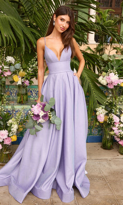 A periwinkle Ava Presley 47399 floor-length gown with a deep V-neckline and full skirt, held by a woman carrying a bouquet of flowers.