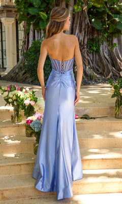 Back view of the Long Prom Dress: Ava Presley 47404, a light blue, strapless beaded corset dress with a lace-up bodice, worn by a woman on stone stairs.