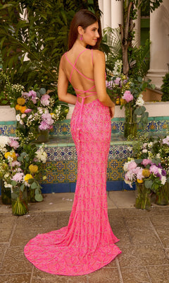 A woman wearing an Ava Presley 47428 floor-length, bright pink beaded prom dress with a strappy open back and a train.