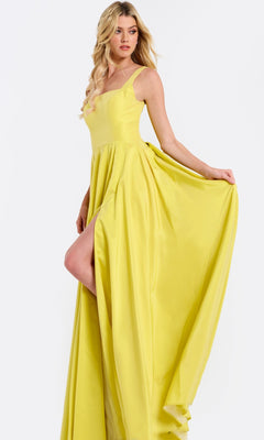 A woman poses in the Jovani 47496, a sleeveless long prom dress with an A-line flowy skirt and thigh-high slit, holding the side of her gown.