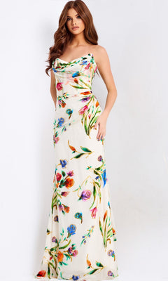 A woman poses against a plain light background, wearing the Jovani 47626 long prom dress—a sleeveless white satin gown with a colorful floral print.