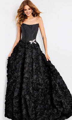 A woman models the Jovani 47695 long prom dress, showcasing its strapless corset bodice, dramatic 3D rosette skirt, and silver bow detail against a plain white background.
