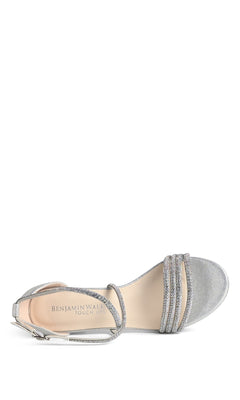 The Tabbie Silver Prom Shoes by Touch Ups (4778) feature an open toe, crystal-embellished straps, ankle strap, low block heel, decorative rhinestones on the toe strap, and visible brand name on the insole.