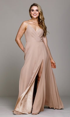 A woman in the Simple V-Neck Long A-Line Prom Dress 477, a sleeveless light beige formal gown with a wrap-style bodice and high slit, stands against a plain background.