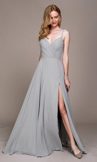 A woman stands against a plain background wearing the Simple V-Neck Long A-Line Prom Dress 477, featuring a light gray color, sleeveless design, thin straps, a V-neckline, and a thigh-high slit.