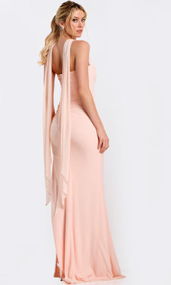 A woman in the Jovani 47874 long prom dress, light pink and form-fitting with draped shoulder details, stands against a plain white background.