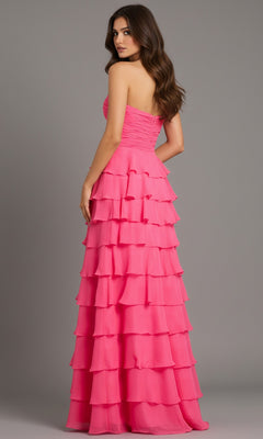 Woman models the Jovani 47898 long prom dress, featuring a strapless ruffle-tiered bodice and chiffon A-line skirt, as she stands looking over her shoulder against a plain background.