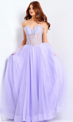 A woman wears the Jovani 48309 long prom dress, featuring a strapless, sheer beaded corset bodice and a full tulle skirt, standing against a white background.