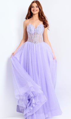 Wearing the Jovani 48309 long prom dress with a strapless corset bodice and full sparkly tulle skirt, a woman smiles as she holds out the sides of her gown.