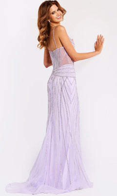 A woman poses facing away, smiling over her shoulder in the Jovani 48375 long prom dress—lavender, floor-length, with thin straps and silver embellishments—against a plain white background.