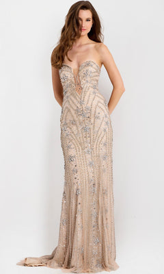 A woman stands against a plain white background wearing the Jovani 48389 long prom dress, a strapless, floor-length nude gown adorned with silver sequins and beaded embellishments.