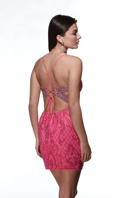 A woman in the Alyce Open-Back Short Beaded Hoco Dress 4842, a pink sleeveless mini party dress with a crisscross open back, stands looking left against a white background.