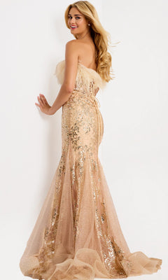 Wearing the Long Prom Dress: Jovani 48465, a woman stands against a white wall, looking over her shoulder and smiling.