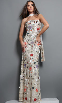 A woman stands against a gray background wearing the Long Formal Dress: Jovani 48587 in Ivory/Multi—an exquisite strapless, floor-length gown adorned with stunning red, purple, and white floral embroidery. A matching scarf is elegantly draped over her shoulder, perfectly completing this elegant look.