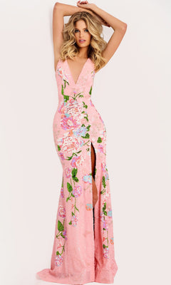 A woman stands against a plain background wearing the Jovani 48636 Long Prom Dress, a floor-length, sleeveless pink gown featuring a deep V-neck, beaded floral embroidery, and a high front slit.
