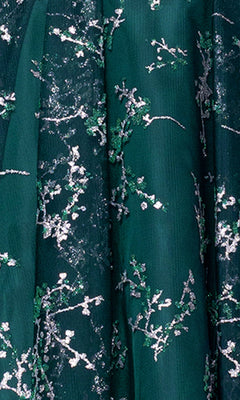 Close-up of dark green fabric with silver and green embroidered floral patterns from the Short Glitter Hoco Dress: Blondie Nites 4884BN—perfect for a sparkling party or junior homecoming look.