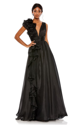 A woman wearing the Mac Duggal 48856 Ruffled Long Prom Ball Gown—a black evening dress with a deep V-neck and ruffled details on one shoulder and along the skirt—stands against a white background.