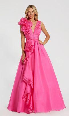 A woman models the Mac Duggal 48856 Ruffled Long Prom Ball Gown, featuring bright pink fabric, a one-shoulder ruffle detail, and cascading ruffles on the skirt against a plain background.