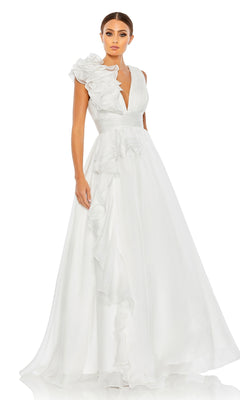 A woman wears the Mac Duggal 48856 Ruffled Long Prom Ball Gown, a floor-length white dress with a deep V-neck and ruffled shoulder detail, standing against a plain white background.