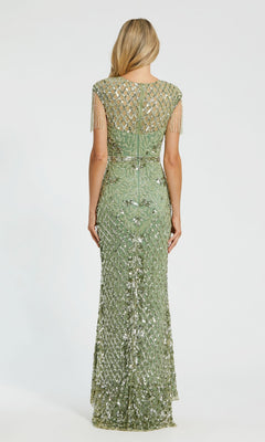 A woman faces away, wearing the Cap-Sleeve Beaded Formal Gown: Mac Duggal 4908—a floor-length, light green sequined evening dress with a sheer back and short beaded fringe sleeves.