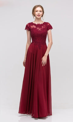 A woman wears the Eureka 4909, a short-sleeve long A-line formal dress featuring an embroidered lace bodice and flowing chiffon skirt in burgundy, beautifully displayed against a plain light background.