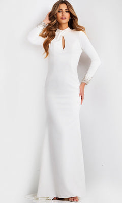 A woman wears the Jovani 49126 Long Prom Dress in off white—a floor-length crepe gown with long sleeves, a front keyhole detail, and embellished cuffs—standing against a plain light background.