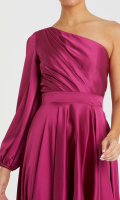 A person wearing the Mac Duggal 49141 One-Sleeve High-Low Prom Dress in magenta satin, featuring a fitted waist, long left sleeve, and elegant evening gown style.