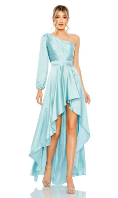 A woman wears the Mac Duggal 49141 One-Sleeve High-Low Prom Dress in light blue—an elegant, asymmetrical formal gown with a single long sleeve, paired with silver heels, perfect for special occasions.