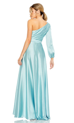 A woman models the Mac Duggal 49141 One-Sleeve High-Low Prom Dress in light blue satin, featuring a single long sleeve and a graceful, flowing silhouette as she stands slightly turned away.