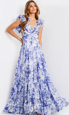 A woman models the Jovani 49143 Ruffled Long Print Prom Dress, featuring a floor-length blue and white floral design with ruffled sleeves and a deep V-neck, set against a plain white background.