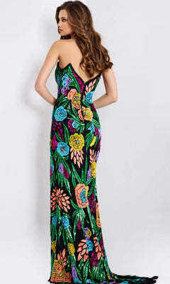 A woman faces away in a Jovani 49234 long prom dress—strapless, fitted, floor-length, black with colorful floral patterns—and looks over her shoulder.