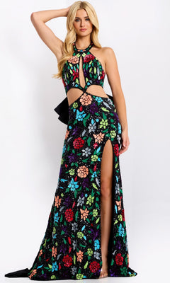 A woman wears the Jovani 49251 long prom dress—a sleeveless, floor-length black gown with a halter neckline, vibrant floral patterns, waist cutouts, and a thigh-high slit—standing against a plain background.