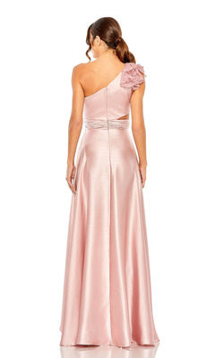 Woman in the Mac Duggal 49523 one-shoulder wedding guest dress, a long light pink gown with a floral detail and left shoulder cut-out, perfect as a high-low style, shown from the back.