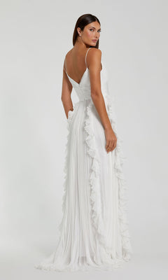 A woman models the Ruffled Long White Formal Dress 49533, standing with her back to the camera and glancing over her shoulder against a plain background.