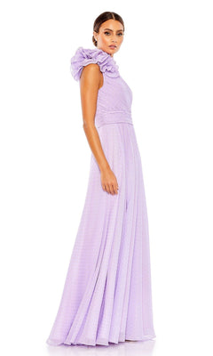 A woman stands against a white background wearing the Mac Duggal 49536 one-shoulder long formal dress in lavender, featuring a floor-length silhouette and ruffled shoulder detail.