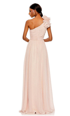 A woman is shown from the back in the Mac Duggal 49536 One-Shoulder Long Formal Dress, a light pink gown featuring a floor-length silhouette and ruffled shoulder detail.