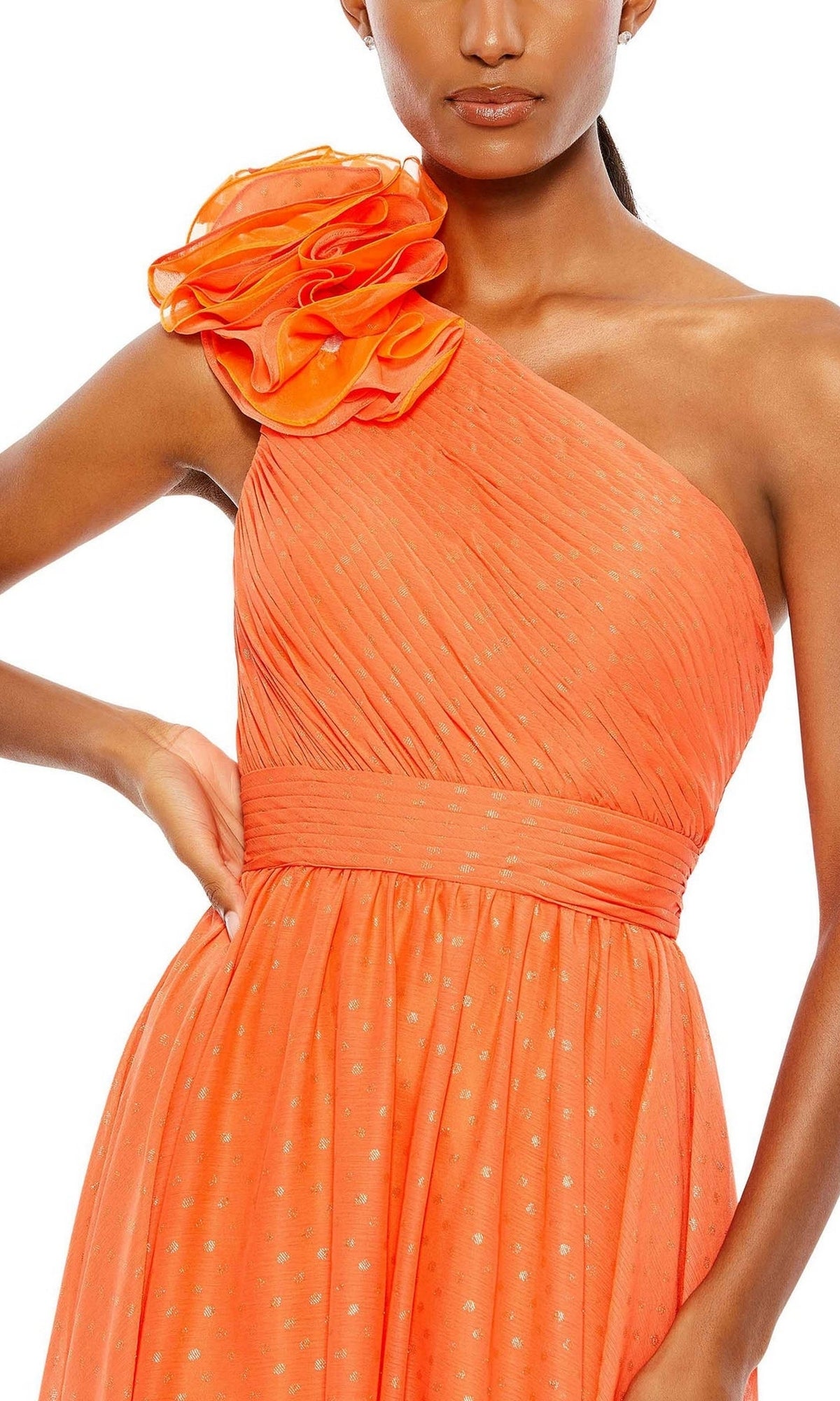 A woman wears the Mac Duggal 49536, a one-shoulder orange pleated long formal dress with ruffled shoulder detail and fitted waistband—perfect as a bridesmaid dress.