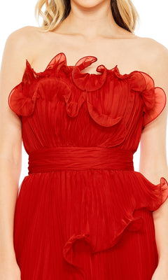 A woman in the Long Formal Dress 49537 by Mac Duggal, a strapless red gown with a pleated A-line silhouette and ruffled detailing along the top edge.