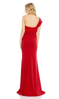 A woman stands facing away, wearing the Mac Duggal One-Shoulder Long Bow Prom Dress 49547, a floor-length red gown with an open back.