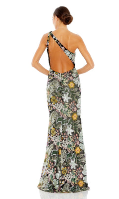 A woman with her hair in a bun faces away from the camera, wearing the Mac Duggal 49574 One-Shoulder Sequin Formal Dress, which is floor-length and backless with a multicolored floral pattern.