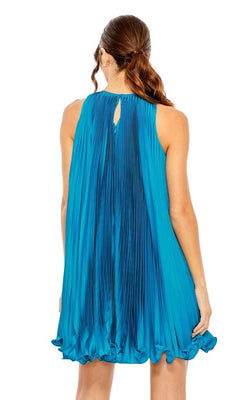 A woman with brown hair in a low ponytail is seen from the back wearing the Mac Duggal 49636, a sleeveless, loose-fitting, high-neck short pleated semi-formal dress.