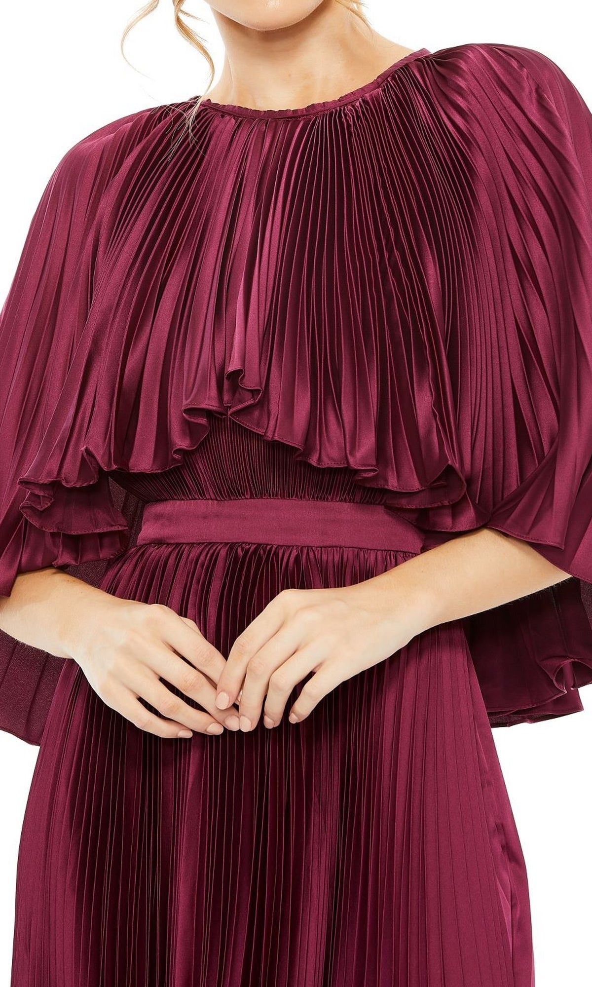 Woman wearing the Caped Tea-Length Party Dress: Mac Duggal 49638 in burgundy, a pleated A-line party dress with flutter sleeves, shown from shoulders to waist against a white background.